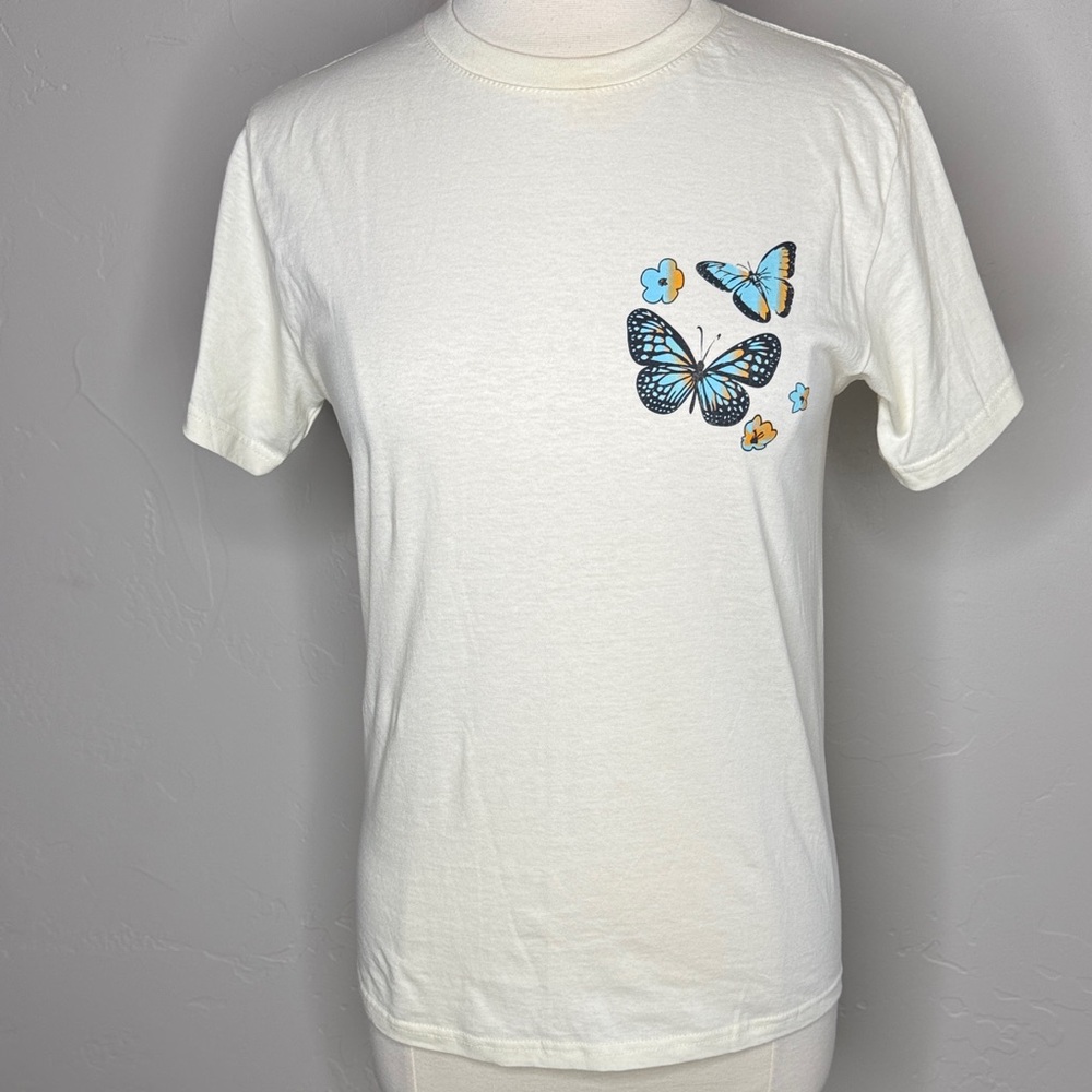 Rebellious One Cream Tee with Blue & Yellow Butterfly Graphic on Front & Back